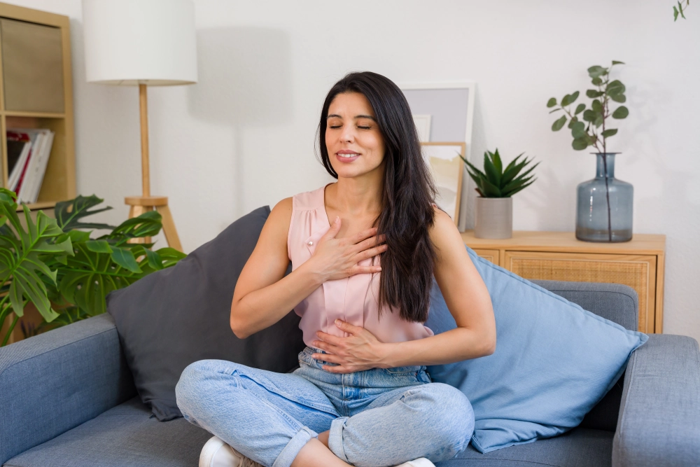 Relaxed woman practicing mindfulness at home